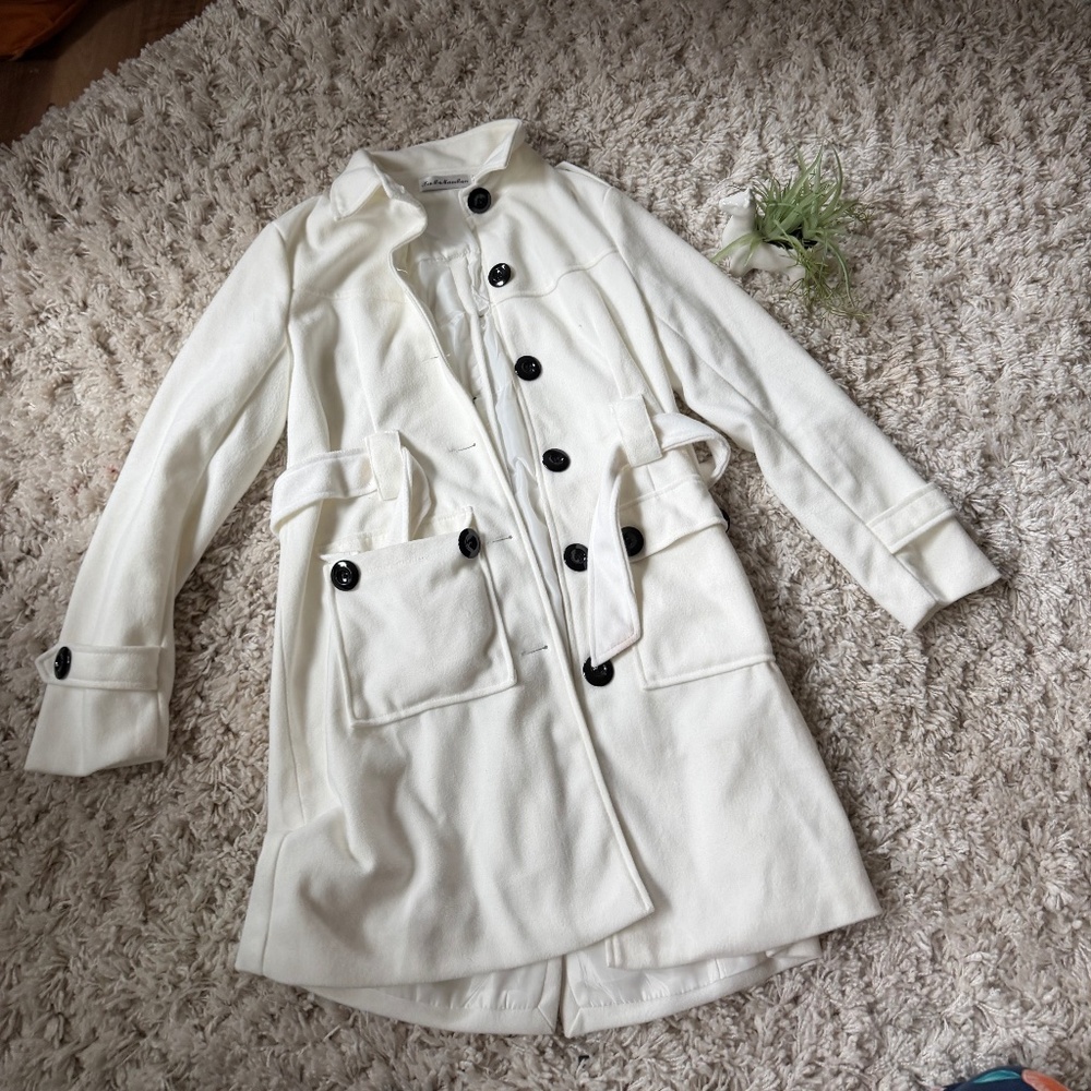 Elegant long peacoat winter coat style Ivory Trench Coat with Black Accents. Thi